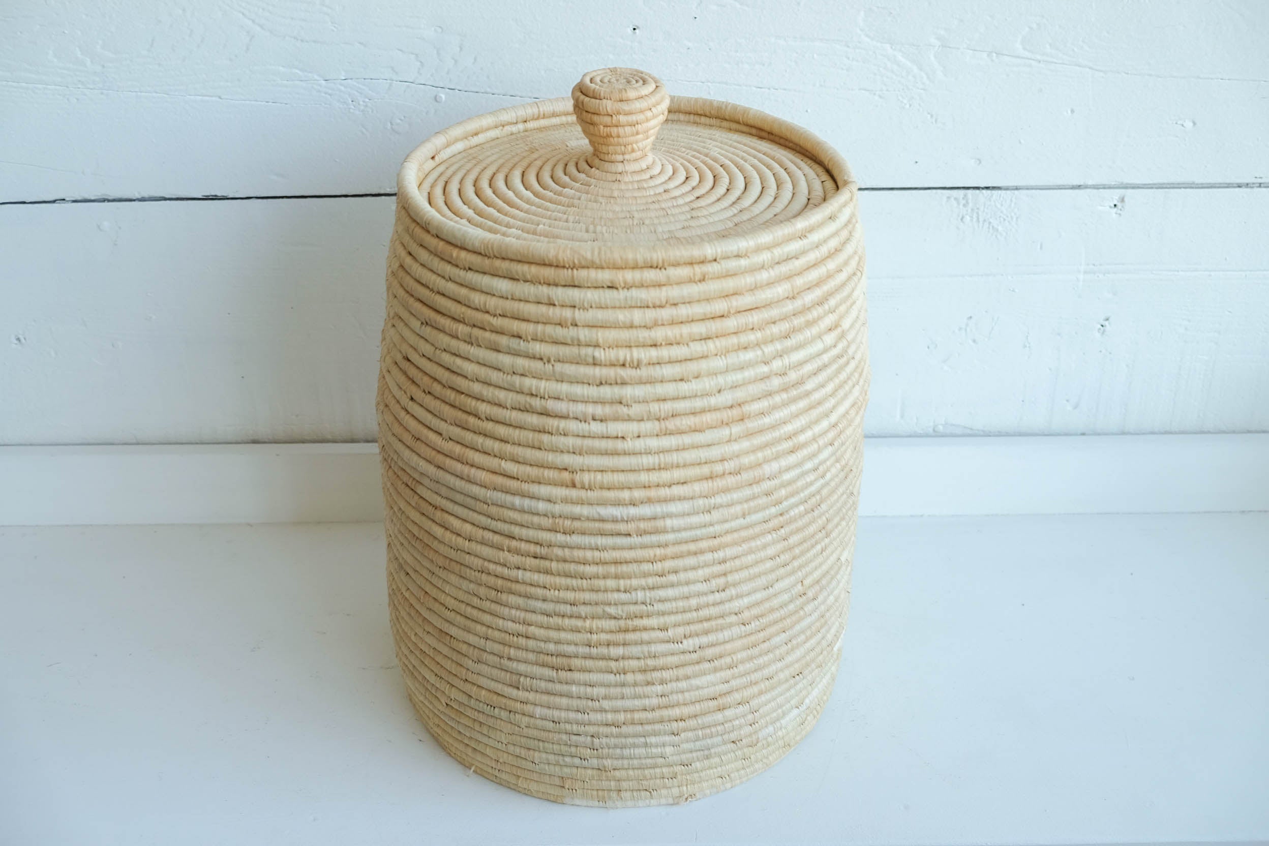 Raffia lidded basket