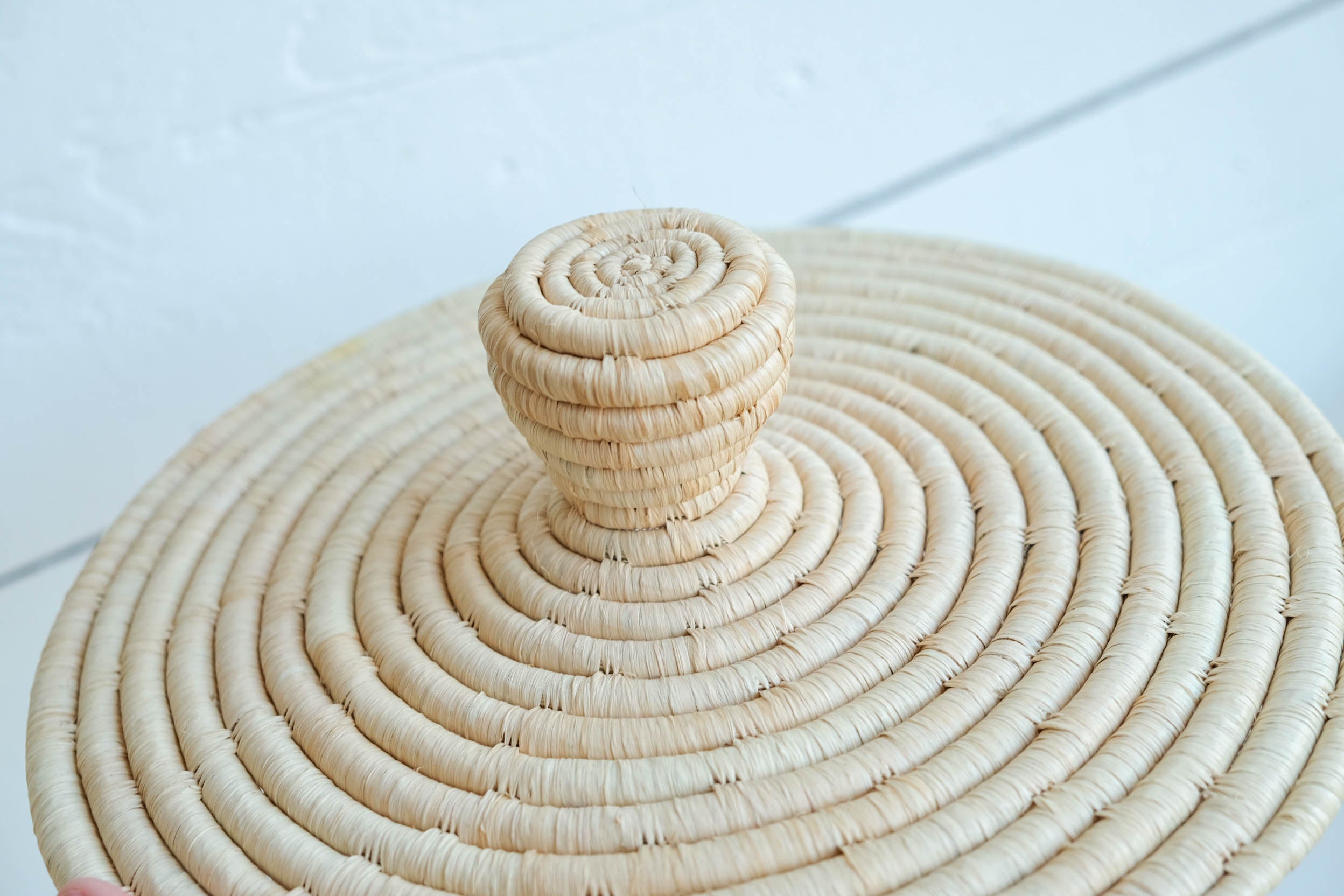 Raffia lidded basket